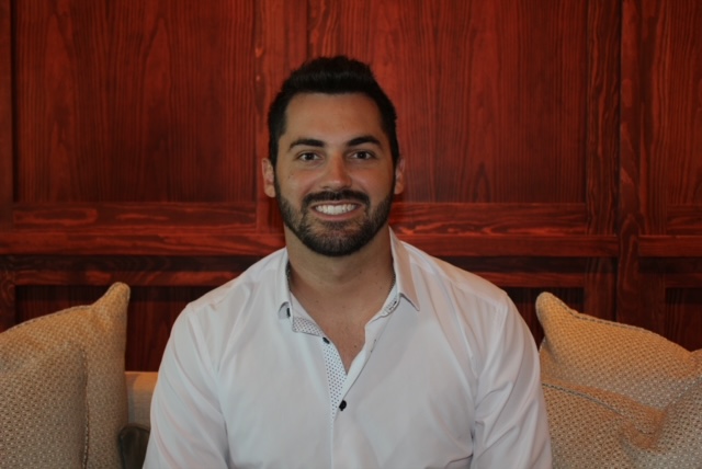 Close up shot of a man smiling at the camera