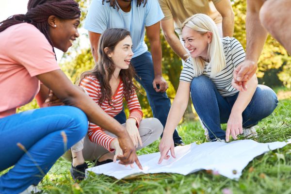 Some girls smiling while talking in a ground